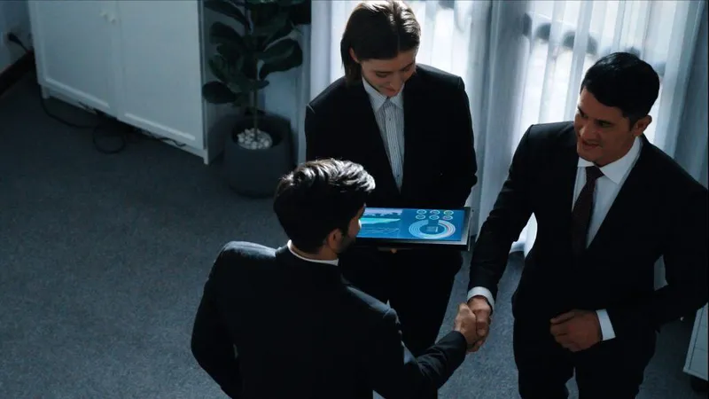 Top Down View Smart Manager Standing With Team Analyze Data Directorate X - Certified Investor Relations Officer study guide