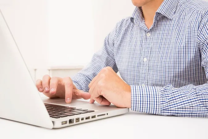 Businessman S Hand Browsing Lapt - Cisco CCNA study guide