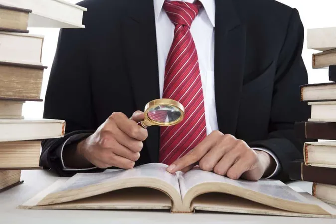 Midsection Man Holding Book X - Certified Legal Investigator study guide