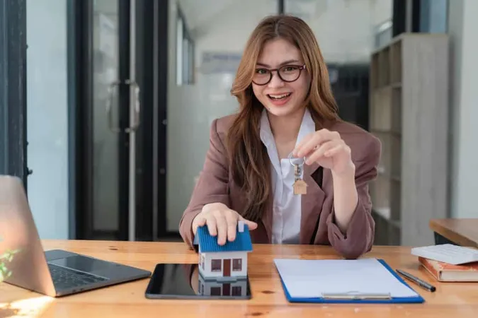 Real Estate Agent Holding Key From New House Apartment Modern Office Concept Financial Home Loan Moneysaving House Buying Real Estate Insurance X - Certified Mortgage Processor study guide