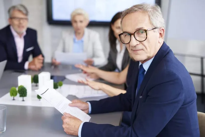 Portrait Senior Businessman Conference X - Certified Project Director study guide