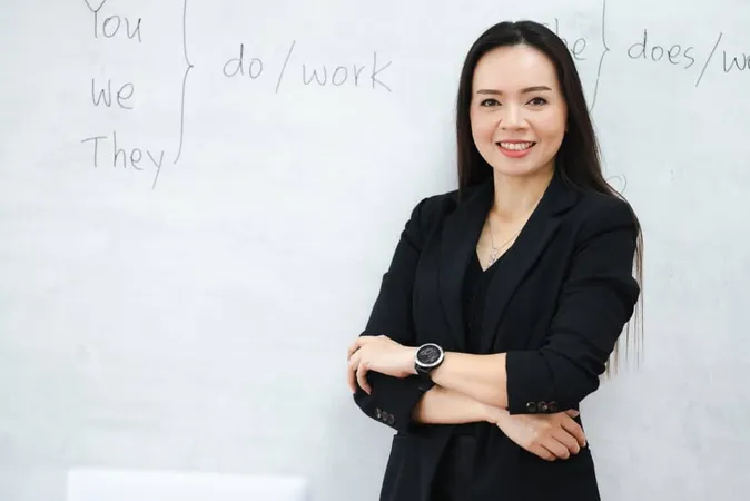 Middle Aged Asian Woman Teacher Classroom White Board University X - Certified Postsecondary Instructor study guide