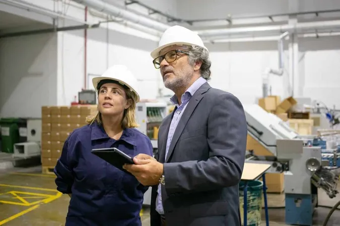 Confident Bearded Supervisor Talking With Female Plant Worker Holding Tablet X - Certified Quality Inspector study guide