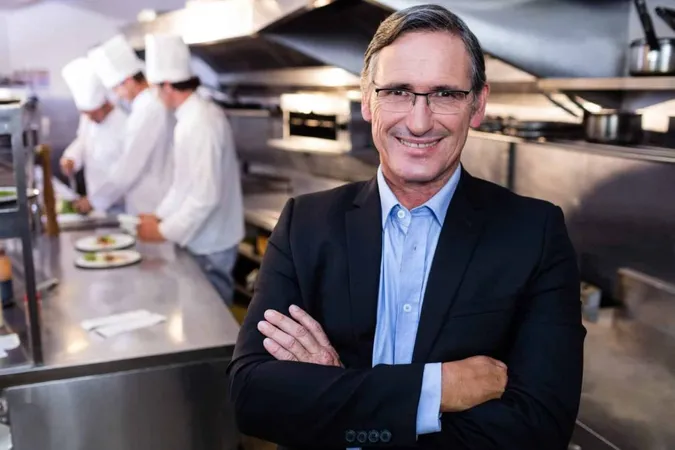 Male Restaurant Manager Standing With Arms Crossed X - Certified Restaurant Professional study guide