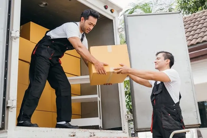 Teamwork Action Removal Service Workers Unload Boxes Furniture From Truck Into New Home Their Efficiency Ensures Smooth Move Brings Happiness Moving Day - Certified Relocation Professional Appraiser study guide