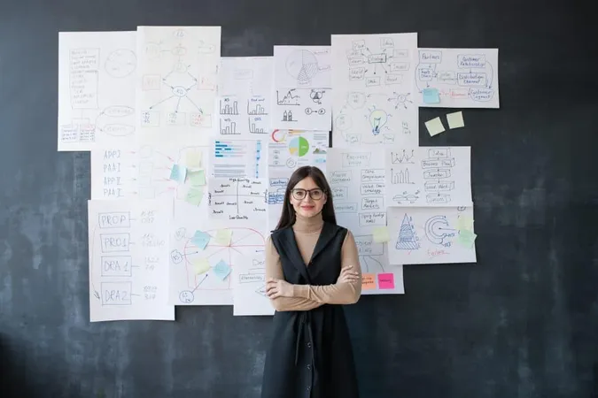 Young Elegant Female Economist Standing By Blackboard With Flow Charts Diagrams Papers X - Certified Strategist study guide