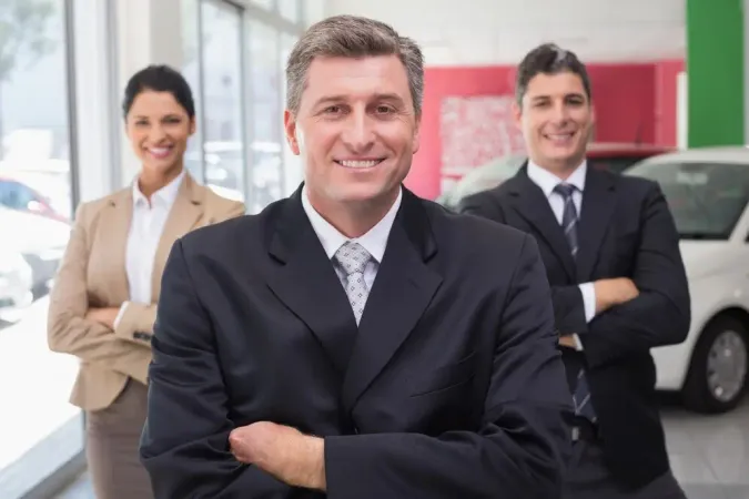 Smiling Business Team Standing With Arms Crossed - Certified Sales Executive study guide