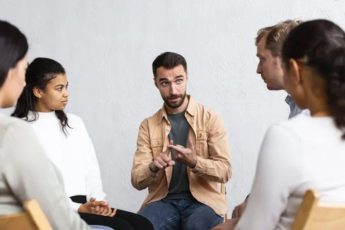 Man Explaining His Problems Group Therapy Session 1 X - Certified Sociological Practitioner study guide