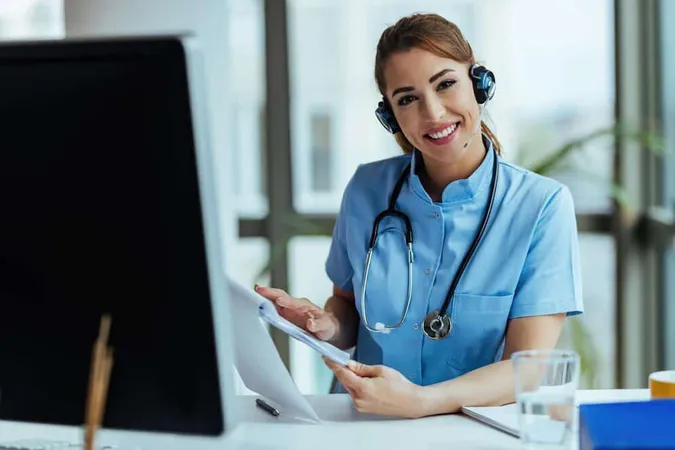 Young Happy Healthcare Worker Wearing Headset While Working Call Center Hospital - Certified Telehealth Coordinator study guide