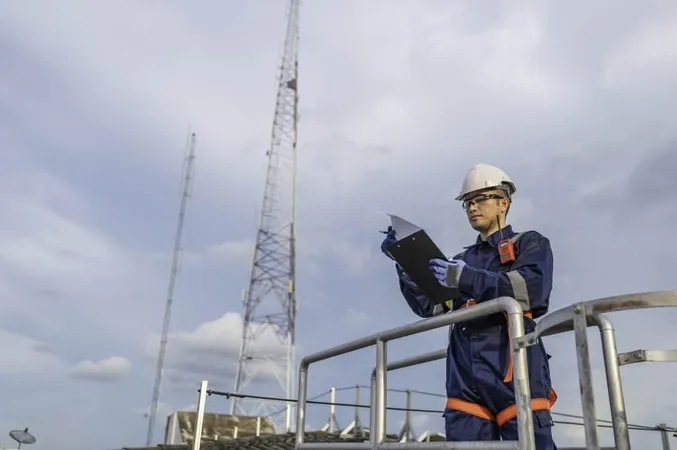 Engineer Full Safety Gear Climbing Ladder Inspect Communication Signals Industrial Machinery Highrisk Transportation Facility X - Certified Telecommunications Engineer study guide