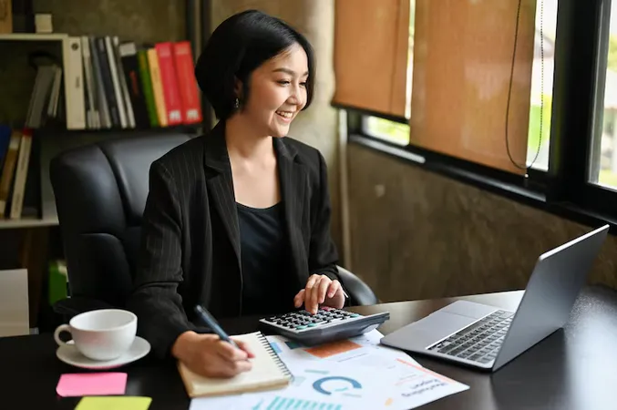 Happy Asian Businesswoman Is Satisfied With Her Business Income While Calculating Sales - Certified Tax Professional study guide