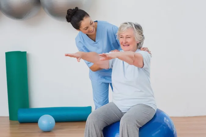Instructor Assisting Senior Woman Exercising X - Certified Therapeutic Recreation Specialist study guide
