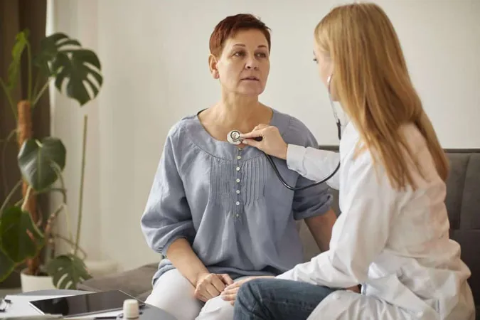 Covid Recovery Center Female Doctor Checking Elder Patient S Heartbeat X - Dysrhythmia Certification study guide