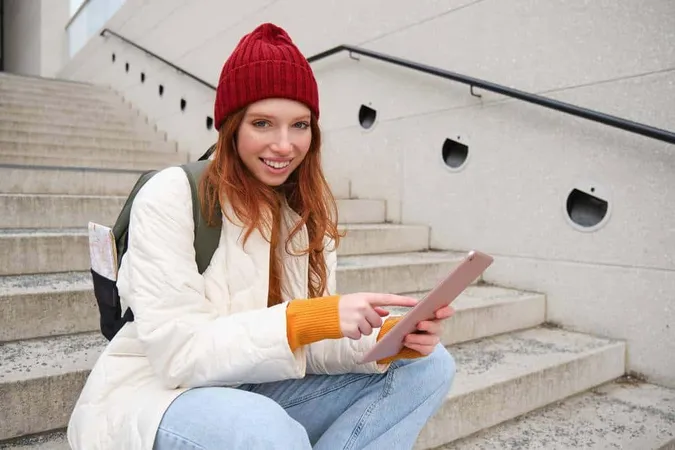 Young Stylish Girl Redhead Female Students Sits Stairs Outdoors With Digital Tablet Reads Uses So - Digital Literacy Certification study guide