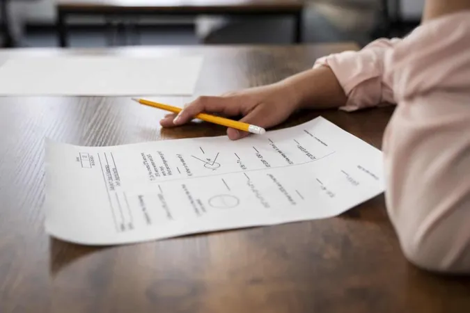 Side View Kid Cheating School Test 1 X - EduTest Practice Test study guide