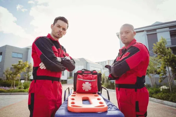 Smiling Paramedics Standing With Arms Crossed X - Emergency Medical Technician study guide
