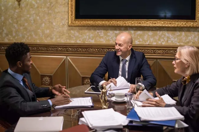 Group Intercultural Lawyers Gathered By Table Having Discussion X - Federal Acquisition Certification study guide