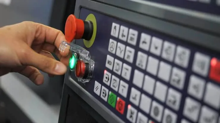 Closeup Pressing Buttons Machine Control Panel Media Starting Production Machine Using Control - Fuji Automatic Numerical Control Robotics Certification study guide