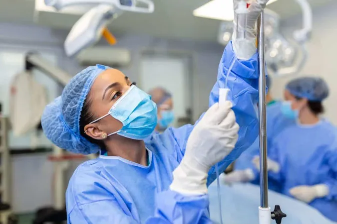 African American Female Doctor Operating Room Putting Drugs Through Iv Surgery Concepts X - Fellowship of the Australian and New Zealand College of Anaesthetists study guide