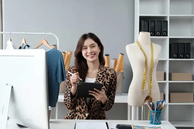 Asian Female Clothing Designer Working Inside Office X - Fashion Designer study guide