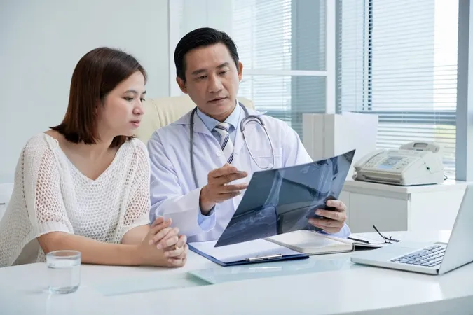 General Practitioner Showing Feet X Ray Patient Explaining Symptoms Tumor X - Healthcare Consultant Certification study guide