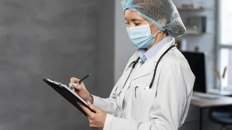 Side View Female Doctor With Medical Mask Hairnet Holding Clipboard X - Health Inspector Certification study guide