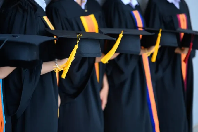 Female Students Holding Mortarboards While Standing University X - Honors Program study guide