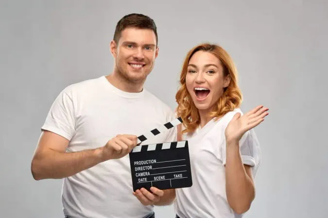 Happy Couple White Tshirts With Clapperboard X - Intimacy Directors and Coordinators Certification study guide
