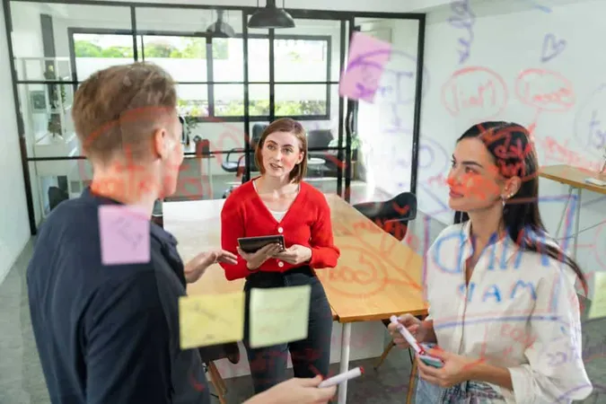 Creative Business Team Sharing Idea Writing Down Sticky Note Immaculate X - Inclusive Event Strategist Certification study guide