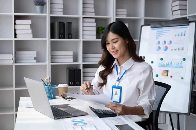 Young Adorable Asian Businesswoman Working Her Modern Office Room X - Ignite Entry Exam study guide