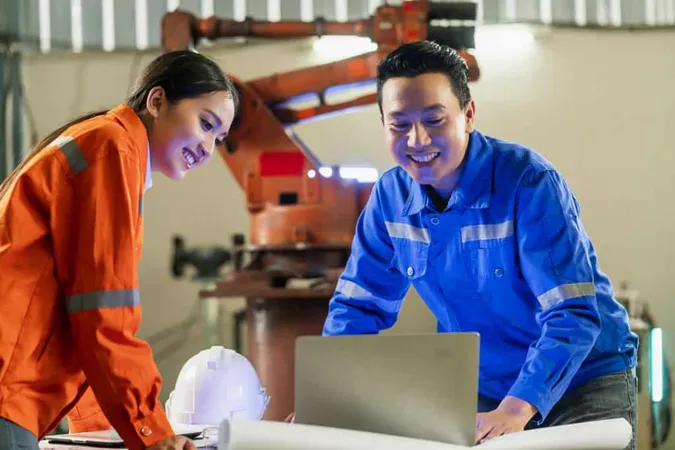 Engineer Cooperation Two Asian Male Female Technician Maintenance Inspect Relay Robot System With Tablet Laptop Control Quality Operate Process Work Heavy Industry 40 Manufacturing Factory 1 X - Maintenance Management Certification study guide