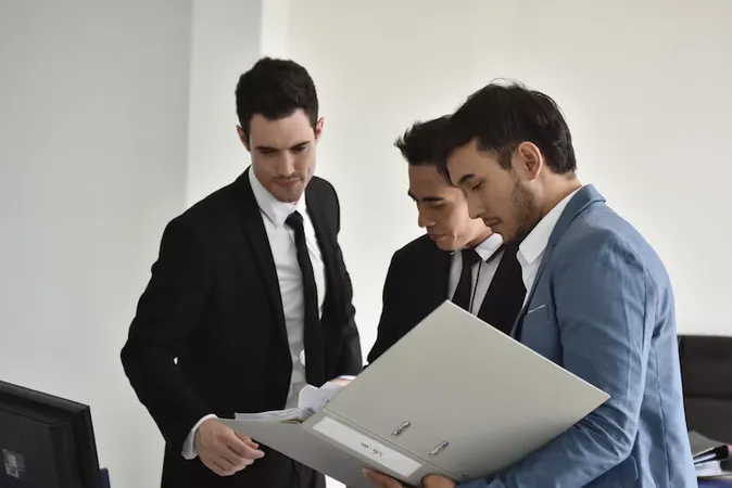 Colleagues Discussing File Office - MRP Certified Agents study guide