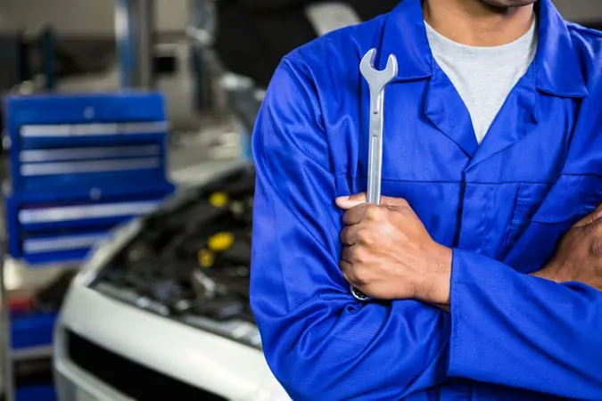 Mechanic With Arms Crossed Holding Spanner X - National Automotive Parts Association Certified Mechanic study guide
