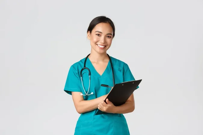 Healthcare Workers Preventing Virus Quarantine Campaign Concept Cheerful Friendly Asian Female Physician Doctor With Clipboard Daily Checkup Standing White Wall X - National Commission on Certification of Physician Assistants study guide