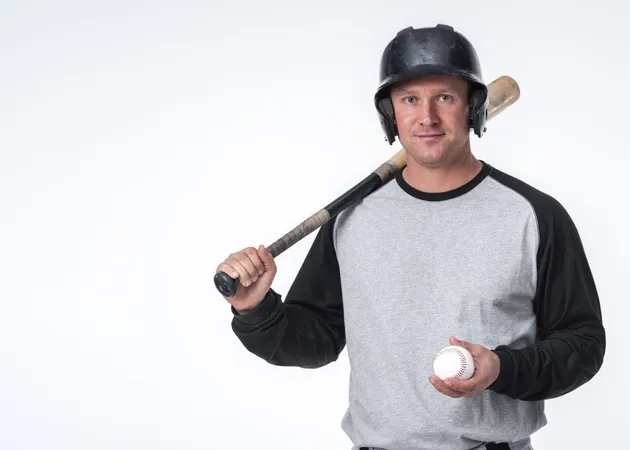 Man Posing With Baseball Hat Ball X - National Federation of State High School Associations Concussion in Sports Certification study guide