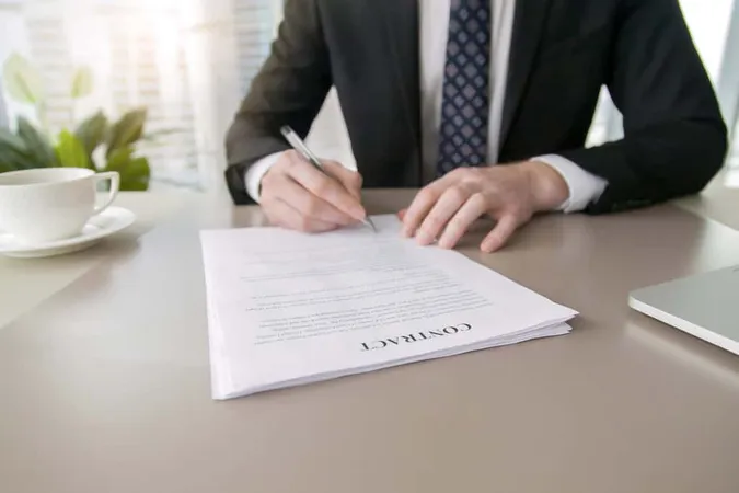 Businessman Signing Contract 1 - Notary study guide