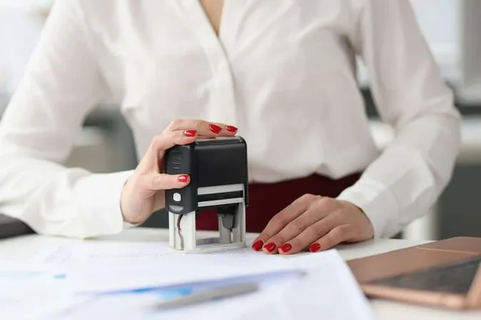 Businesswoman Puts Stamp Credit - Notary study guide
