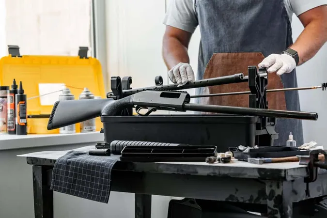 Close Up Gunsmith Cleaning Firearm Barrel With Ramrod Brush X - National Rifle Association Certified Gunsmith study guide