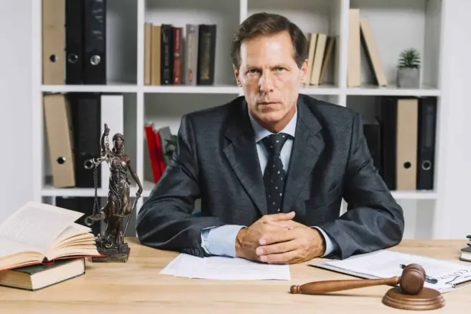 Confident Mature Lawyer Sitting Courtroom X - Notary Signing Agent Certification study guide
