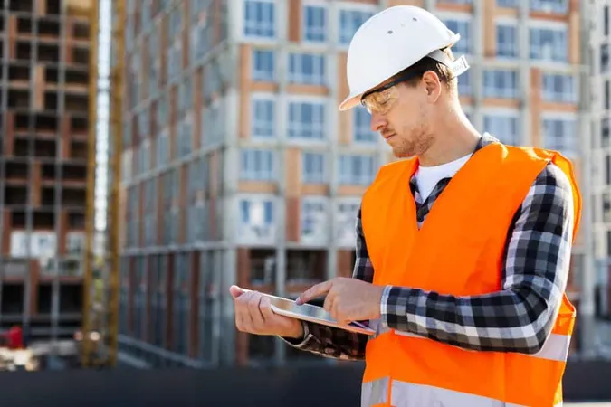 Medium Shot Side View Construction Engineer Using Tablet X - Oregon Inspector Certification study guide