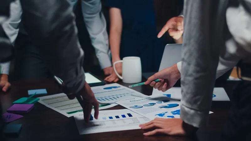 Millennial Asia Businessmen Businesswomen Meeting Brainstorming Ideas About New Paperwork Project Colleagues Working Together Plannin X - Organizational Management Specialty Certification study guide