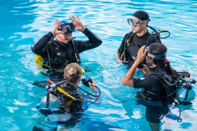 Diving Instructor Teaches How Attach Mask Students X - Certified Professional Association of Diving Instructors Diver study guide