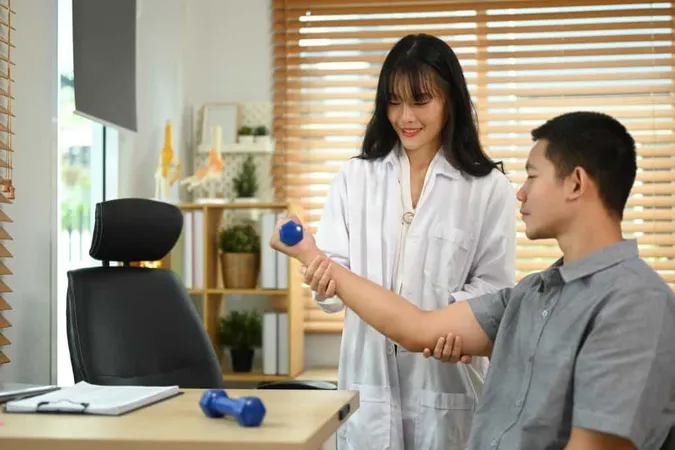 Asian Male Patient Patient Lifting Light Weight Dumbbells Therapist Guidance X - Physical Agent Modalities Certification study guide