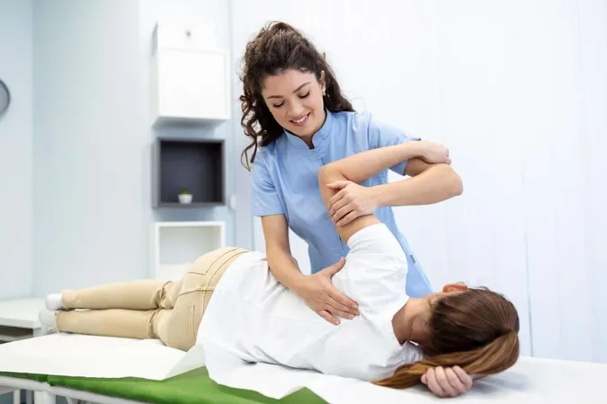 Physiotherapist Treatment Patient Holding Patients Hand Shoulder Joint Treatment Physical Doctor Consulting With Patient About Shoulder Muscule Pain Problems Physical Therapy Diagnosing Concept X - Physiotherapy Competency Exam study guide
