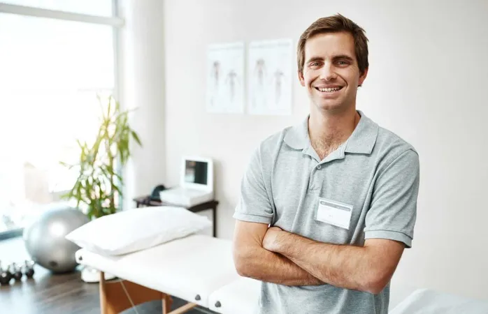 Whatever Pain You Have We Will Sort It Out Portrait Confident Young Male Physiotherapist Standing With His Arms Folded Inside His Office X - Physiotherapy Competency Exam study guide