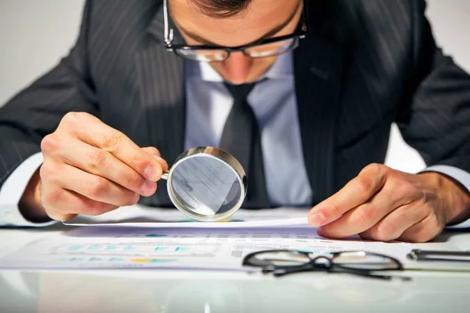 Meticulous Analysis Businessman Inspecting Documents With Magnifying Glass X - Professional Certified Investigator study guide