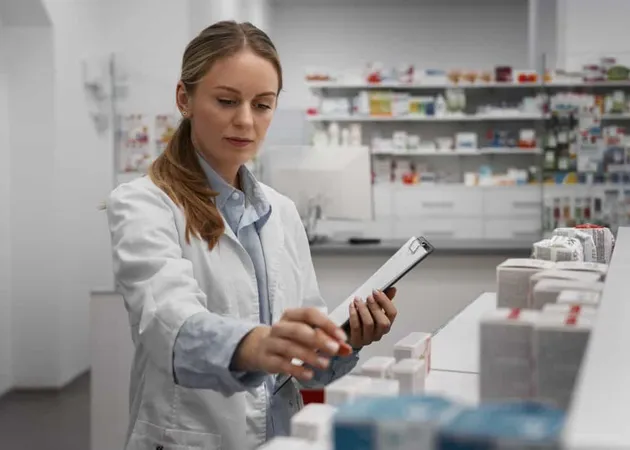 Female Pharmacist Checking Medicine With Clipboard X - Pharmacovigilance Certification study guide