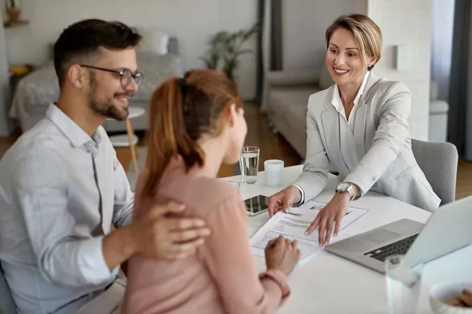 Happy Real Estate Agent Having M - Real Estate study guide