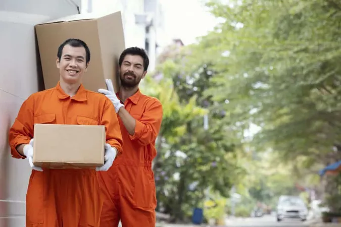 Young Delivery Men Moving Parcel Boxes X - Relocation Specialist Certification study guide