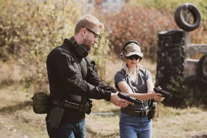 Woman Learns Shoot Pistol Shooting Range With Instructor 2 X - Certified Range Safety Officer study guide